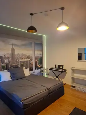 Ein Bett oder Betten in einem Zimmer der Unterkunft Ferienzimmer by Riela im ehemaligem Hotel Schöneck