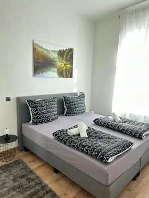 Ein Bett oder Betten in einem Zimmer der Unterkunft Lahnblick Deluxe