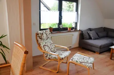 Ein Sitzbereich in der Unterkunft Landhaus Grimburg - Ferienwohnung Obergeschoss