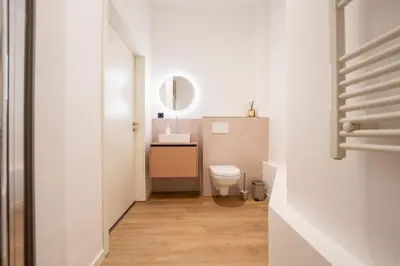 Ein Badezimmer in der Unterkunft LLR Design Apartment - Orange Mandarine im Zentrum von Koblenz