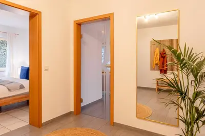Ein Bett oder Betten in einem Zimmer der Unterkunft Pure Zen Suite I Eifelsteig I Sauna I BBQ I Garage
