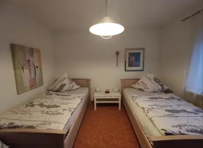 Ein Bett oder Betten in einem Zimmer der Unterkunft Ferienwohnung Rotha