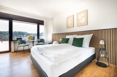 Ein Bett oder Betten in einem Zimmer der Unterkunft City Apartment mit Rheinblick by Moliho