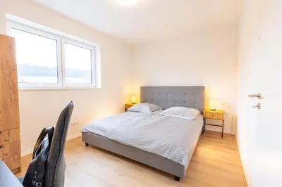 Ein Bett oder Betten in einem Zimmer der Unterkunft Pitlane Apartment 3