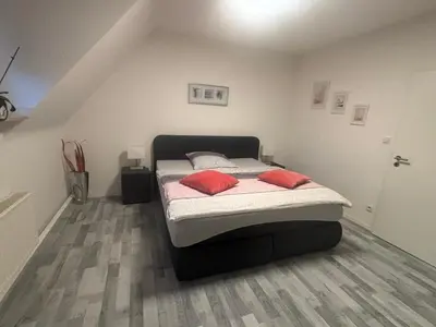 Ein Bett oder Betten in einem Zimmer der Unterkunft Erica Ferienwohnung auf dem Traumpfad