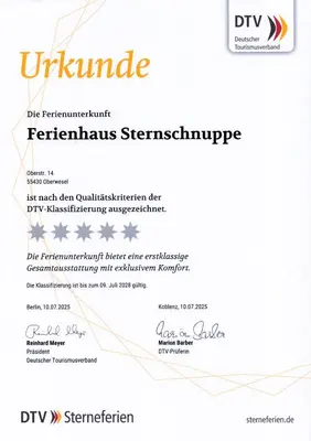Ein Zertifikat, Auszeichnung, Logo oder anderes Dokument, das in der Unterkunft Ferienhaus Sternschnuppe ausgestellt ist