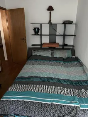 Ein Bett oder Betten in einem Zimmer der Unterkunft Bei EDE & Helli