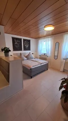 Ein Bett oder Betten in einem Zimmer der Unterkunft Ferienwohnung Altenberg