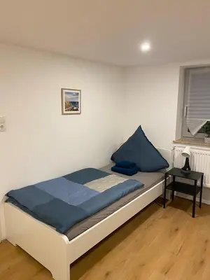 Ein Bett oder Betten in einem Zimmer der Unterkunft Charmantes Haus im Zentrum von Andernach