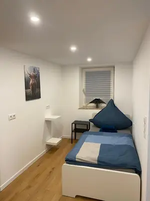 Ein Bett oder Betten in einem Zimmer der Unterkunft Charmantes Haus im Zentrum von Andernach