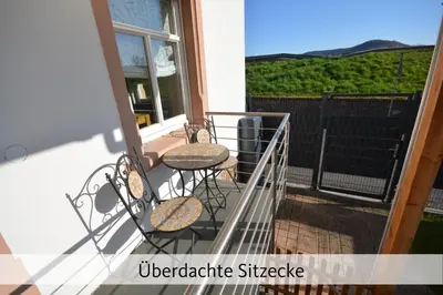 Ein Balkon oder eine Terrasse in der Unterkunft Ferienhaus Anno 1912