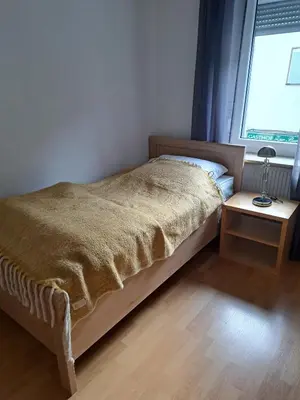 Ein Bett oder Betten in einem Zimmer der Unterkunft Ferienwohnung mit Burgblick