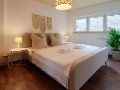 Ein Bett oder Betten in einem Zimmer der Unterkunft Cozy apartment near Mosel - top location - mountain view