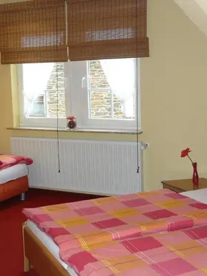 Ein Bett oder Betten in einem Zimmer der Unterkunft Weinhaus Thomas