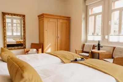 Ein Bett oder Betten in einem Zimmer der Unterkunft St Jakobshof für Moselurlaub mit Familie
