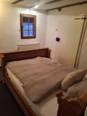 Ein Bett oder Betten in einem Zimmer der Unterkunft Haus Burg, Ferienhaus