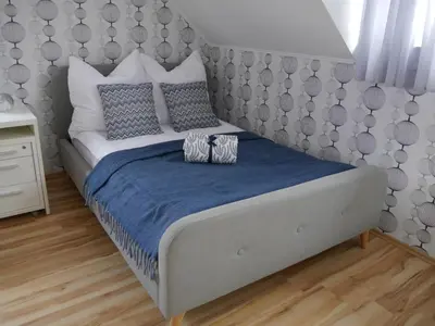 Ein Bett oder Betten in einem Zimmer der Unterkunft Ferienhaus Bitburg