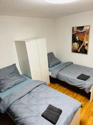 Ein Bett oder Betten in einem Zimmer der Unterkunft Unabhängiges Twin-Apartment