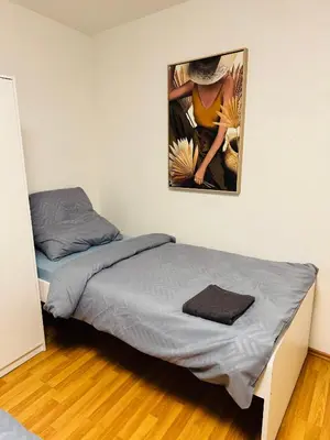 Ein Bett oder Betten in einem Zimmer der Unterkunft Unabhängiges Twin-Apartment