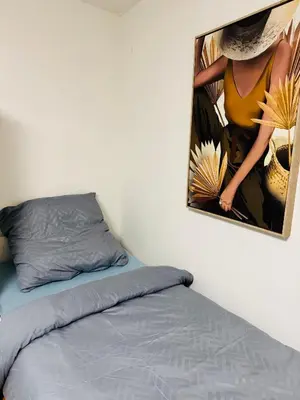 Ein Bett oder Betten in einem Zimmer der Unterkunft Unabhängiges Twin-Apartment