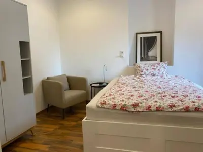 Ein Bett oder Betten in einem Zimmer der Unterkunft Schöne Ferienwohnung in Andernach