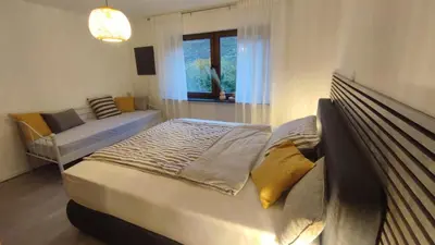 Ein Bett oder Betten in einem Zimmer der Unterkunft Bergblick