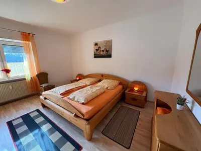 Ein Bett oder Betten in einem Zimmer der Unterkunft FeWo II Glücksmomente Bostalsee