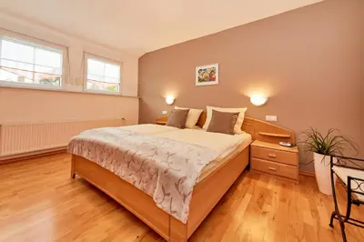 Ein Bett oder Betten in einem Zimmer der Unterkunft WeinGut Hermes