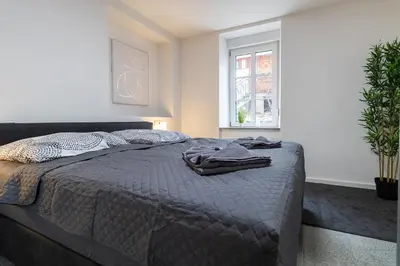 Ein Bett oder Betten in einem Zimmer der Unterkunft Fewomo, Moselzeit Apartment, Stilvolle Fewo für Genießer nähe Schloss