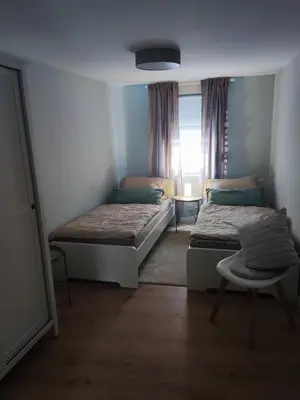 Ein Bett oder Betten in einem Zimmer der Unterkunft Weingut & Gästehaus Melchiors