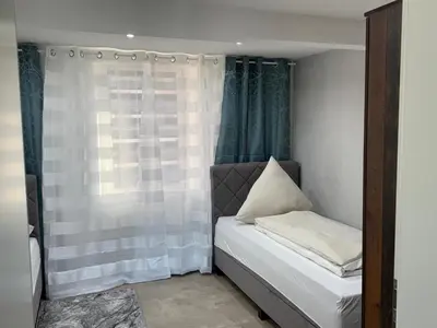 Ein Bett oder Betten in einem Zimmer der Unterkunft Ferienhaus-am-Moselufer