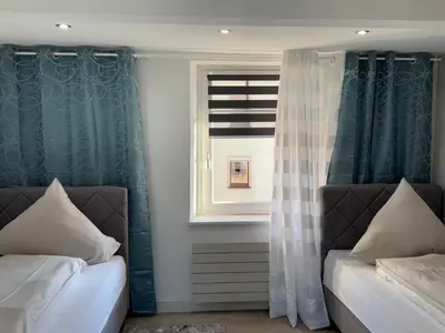 Ein Bett oder Betten in einem Zimmer der Unterkunft Ferienhaus-am-Moselufer