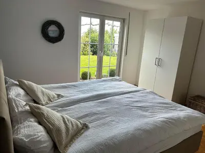 Ein Bett oder Betten in einem Zimmer der Unterkunft Casa Andrea, Ferienwohnung