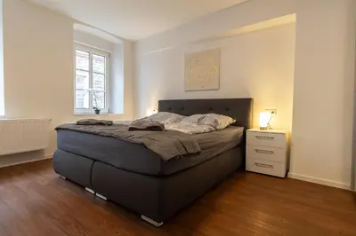 Ein Bett oder Betten in einem Zimmer der Unterkunft Fewomo - Moseltraum ! Exklusive Unterkunft für Genießer - Nah am Schloss
