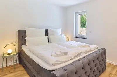 Ein Bett oder Betten in einem Zimmer der Unterkunft ZoHe Apartments Bernkastel-Kues