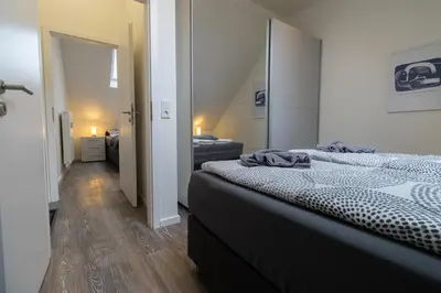 Ein Bett oder Betten in einem Zimmer der Unterkunft Fewomo, MoselSky, Stilvolle Dachgeschoss-Ferienwohnung mit Charme für 6 Personen
