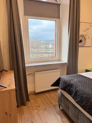 Ein Bett oder Betten in einem Zimmer der Unterkunft Ferienwohnung Mosel One