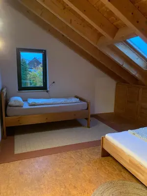 Ein Bett oder Betten in einem Zimmer der Unterkunft Ferienhaus Forsthaus am Feuerbach