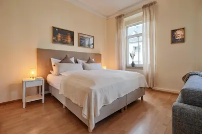 Ein Bett oder Betten in einem Zimmer der Unterkunft MARX - Studio-Apartment im Zentrum von Trier - Top-Lage, Gratis WLAN, ideal für Paare & Geschäftsreisende