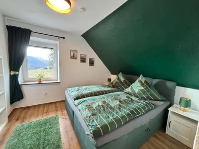 Ein Bett oder Betten in einem Zimmer der Unterkunft harmony holiday, Pension
