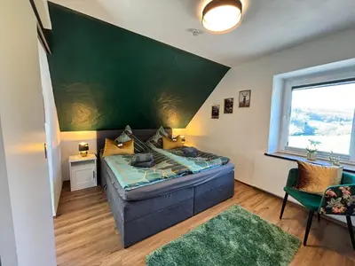 Ein Bett oder Betten in einem Zimmer der Unterkunft harmony holiday, Pension