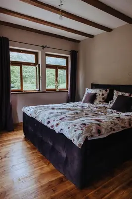 Ein Bett oder Betten in einem Zimmer der Unterkunft Außerhalb2 - Chalet Wassermühle