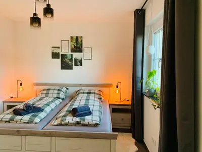 Ein Bett oder Betten in einem Zimmer der Unterkunft Ferienwohnung Auszeit