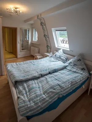 Ein Bett oder Betten in einem Zimmer der Unterkunft FeWo-tt