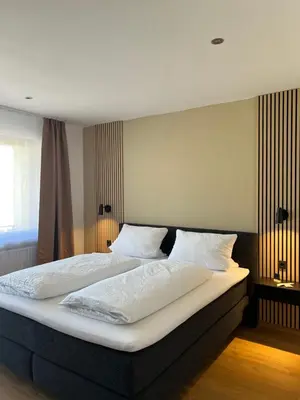 Ein Bett oder Betten in einem Zimmer der Unterkunft Weingut Lindenhof