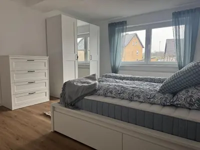 Ein Bett oder Betten in einem Zimmer der Unterkunft Ferienwohnung Bea