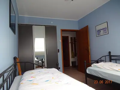 Ein Bett oder Betten in einem Zimmer der Unterkunft Ferienwohnungen Stollhof