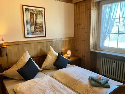 Ein Bett oder Betten in einem Zimmer der Unterkunft Gästehaus Zur Burggräfin
