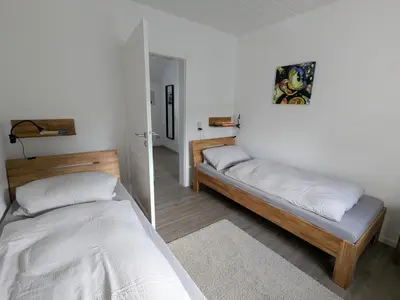 Ein Bett oder Betten in einem Zimmer der Unterkunft Mendiger Basalthaus