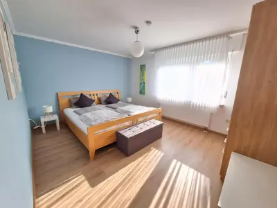 Ein Bett oder Betten in einem Zimmer der Unterkunft Ferienwohnung Bachgeflüster